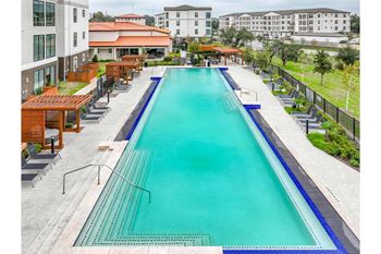 a swimming pool at Reveal at Onion Creek apartments
